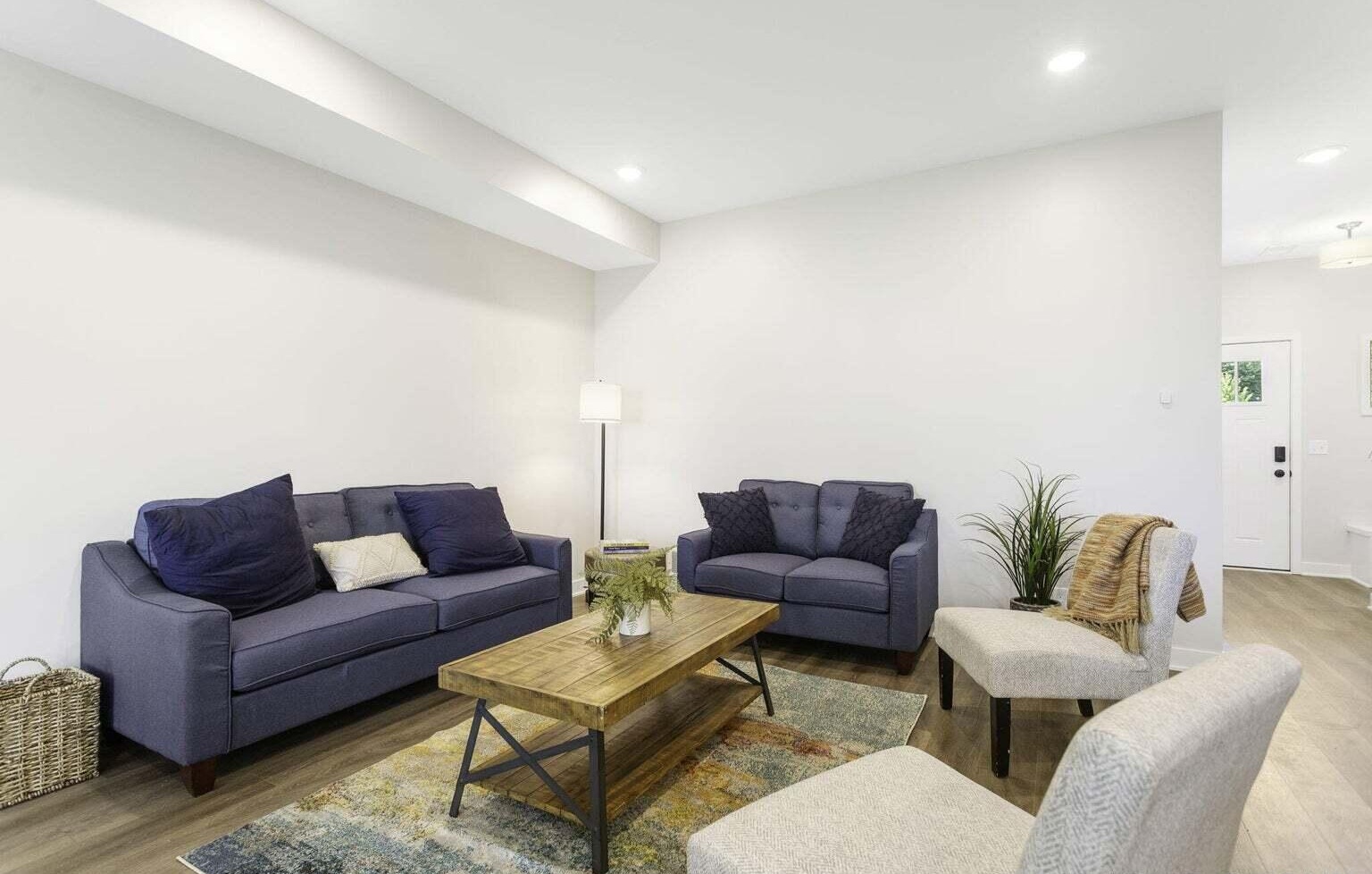 Comfortable living room with contemporary furnishings in a Signature Estates townhome