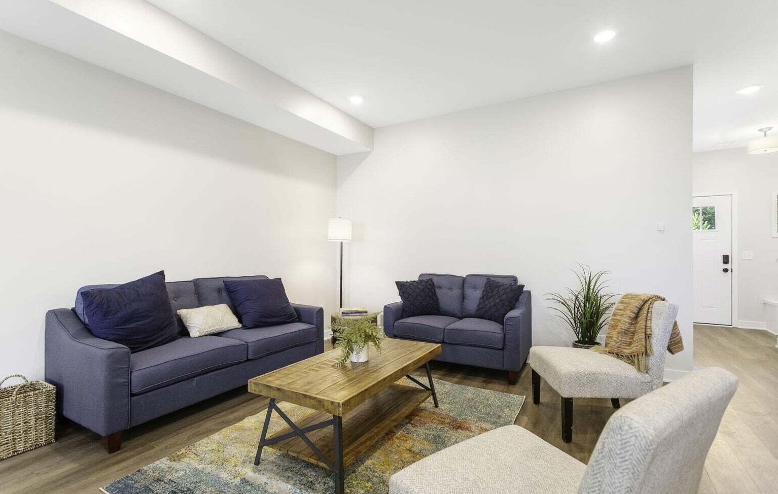 Spacious open-concept living, kitchen and dining area at Signature Estates with modern finishes and abundant natural light